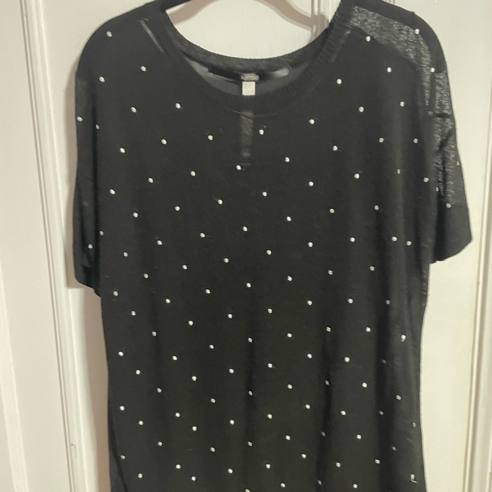 Black sweater like blouse. Decorated on front with white dots. Size M. Very chic